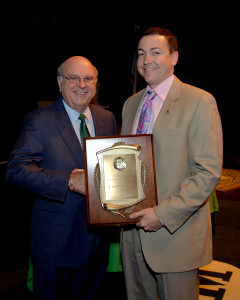Dr. Andrew P. Nichols, right, poses with Interim President Gary White as Nichols receives the Distinguished Artists and Scholars Award last spring. He also was given the Dr. Charles E. Hedrick Outstanding Faculty Award.