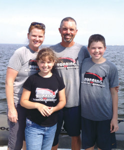 Summerlin and his family on the sea wall at the U.S. Naval Academy in Annapolis with a final 100 miles to go to reach the Atlantic shore. 