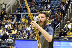 Troy Clemons leads fans at the WVU Men’s basketball game Wednesday, March 2, 2016 in a cheer after being named the 64th Mountaineer Mascot at the Coliseum. Clemons is a senior from Maxwelton, WV and was selected by a committee of faculty, staff and students. Clemons will serve in the 2016-2017 school year.