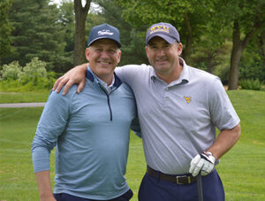 United Bank’s Wood Market President Patrick Bryan, left, and Mock, right,
attend the Kid’s Golf Classic.